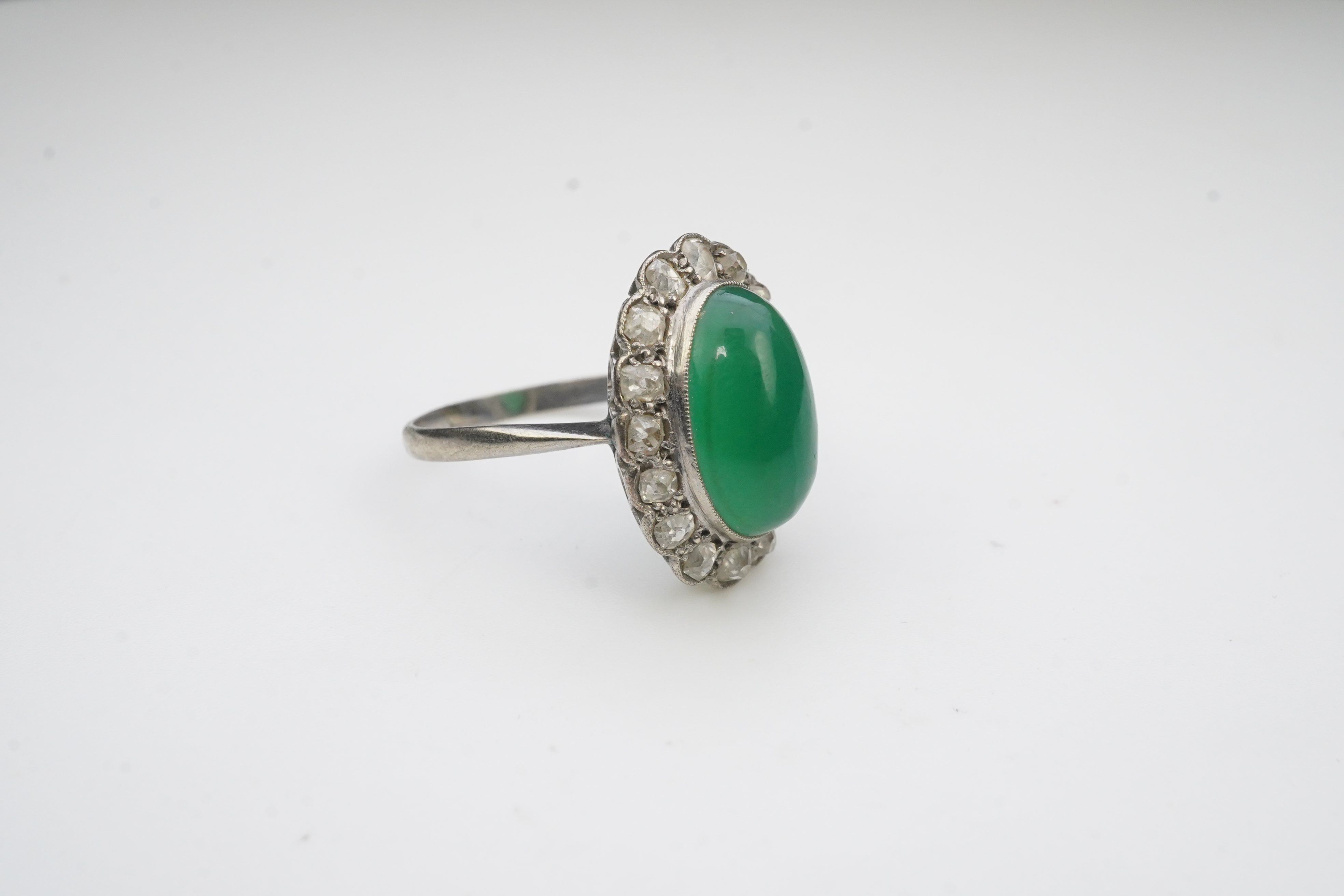 A green chalcedony and diamond ring, early 20th century